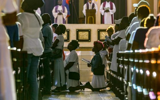 Faithful kneel in prayer during a Good Friday service at the St. Pierre Catholic Church in the Pétion-Ville neighborhood of Port-au-Prince, Haiti, on March 29. (AP/Odelyn Joseph)